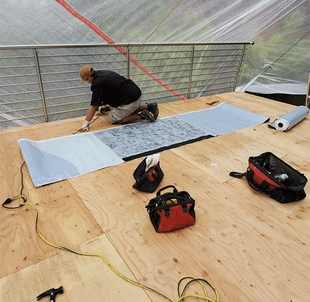 Waterproofing membrane laid out on a prepared plywood deck in San Diego